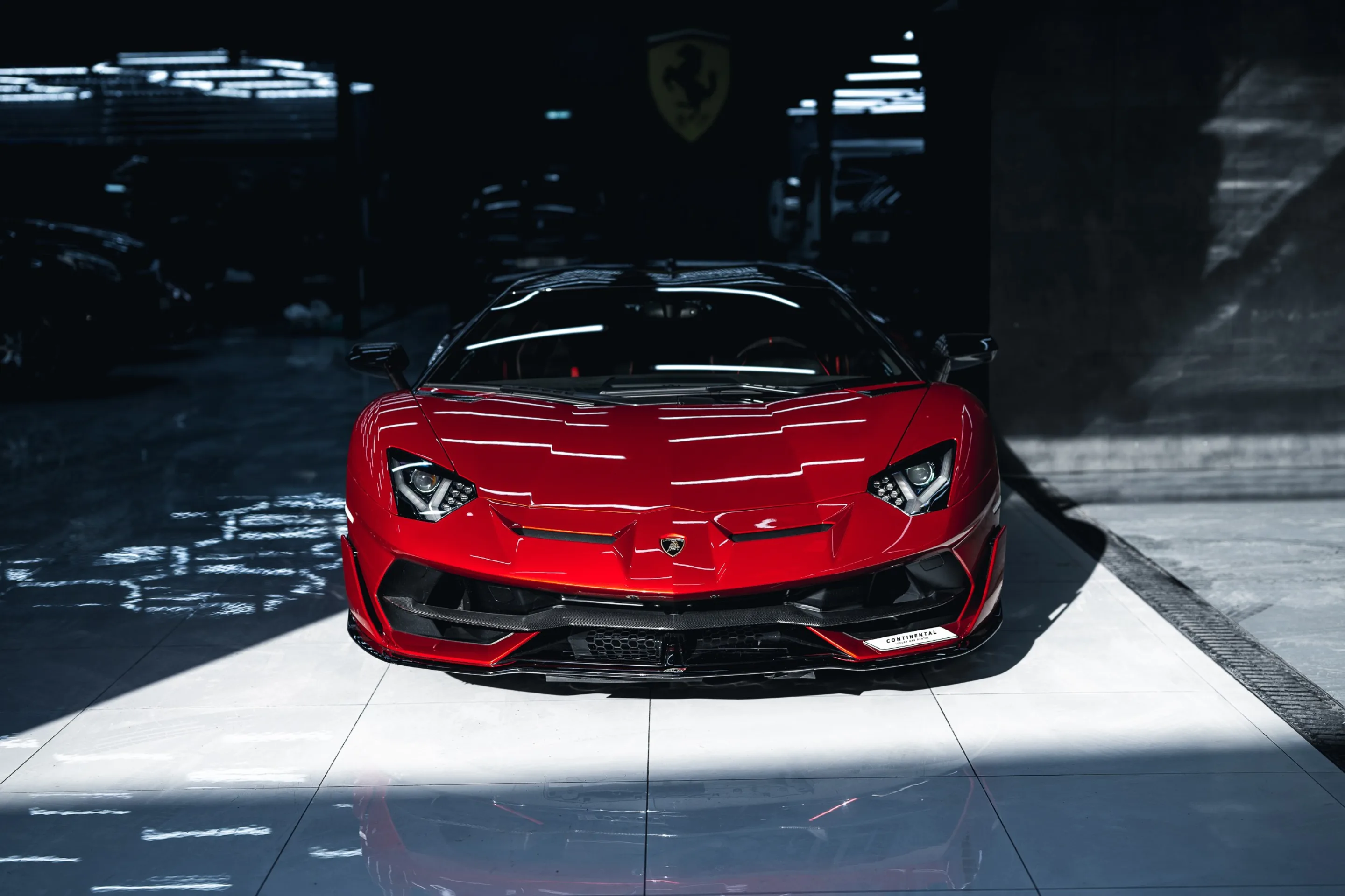 Continental Rental — supercar staged under studio light