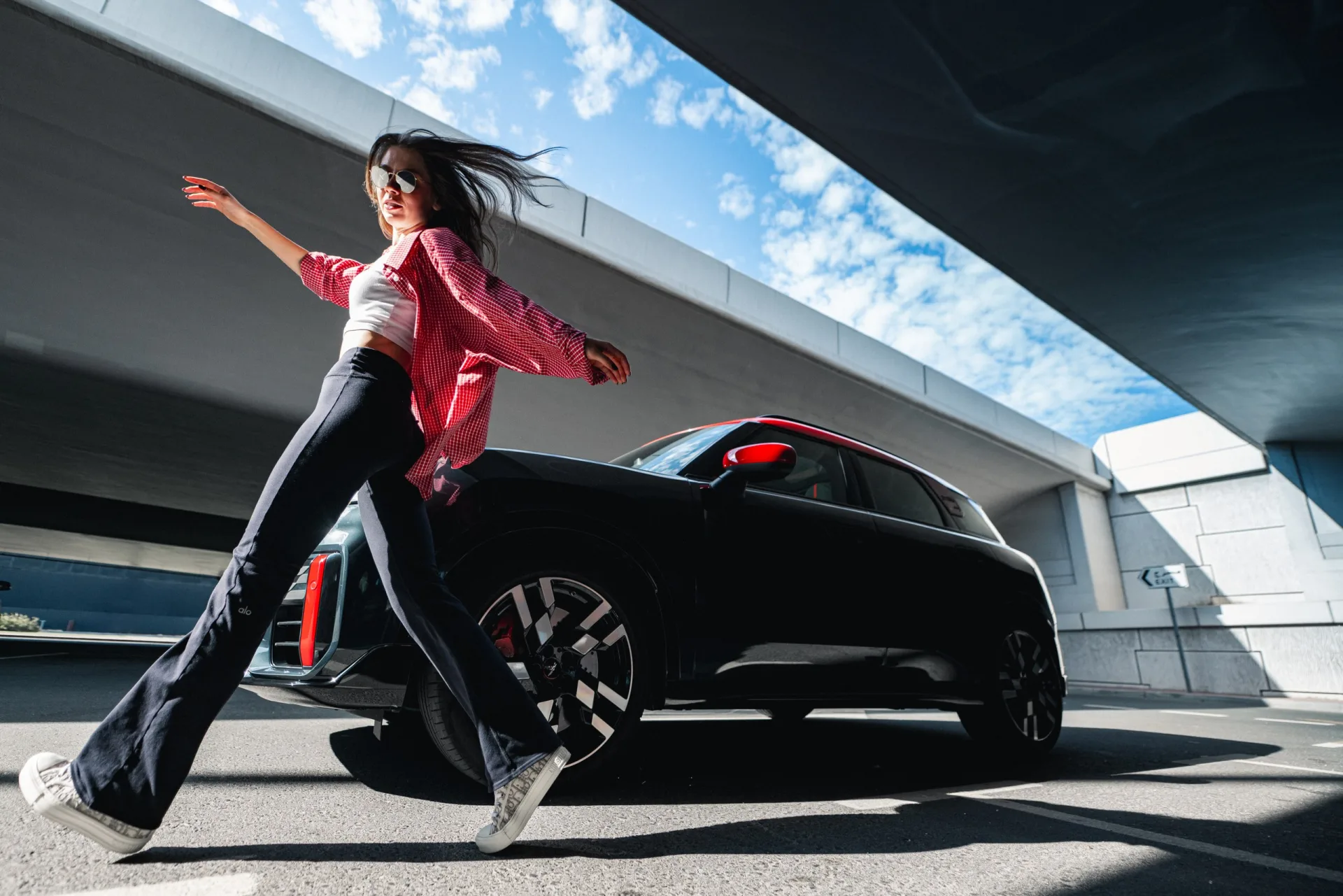 The MINI Countryman JCW mid-drive, shot low and wide in the hyper-real launch style